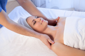 Obraz na płótnie Canvas doctor cosmetologist doing facial massage girl spa