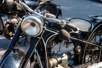 Close-up of motorcycle parked on city street