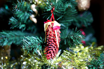 Christmas tree ornament on pine cone
