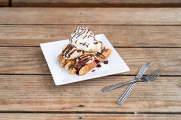 Chocolate Belgium waffle with sauce and whipped cream. Brunch, breakfast, or dessert.