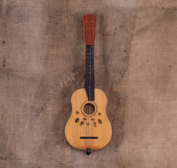 Obraz premium old guitar on dirty brown background
