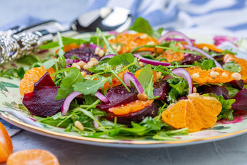 Salad of arugula, baked beets and tangerines.