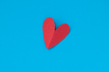 background for Valentine's day holiday, heart on blue background, couple of hearts on red and blue background