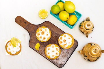 Meyer Lemon Tartlets with Lemon Curd on cutting board