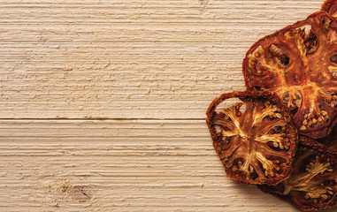 grouping of tomatoes with copy space on white wood