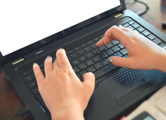 Female fingers on the keyboard. Close-up. Laptop concept
