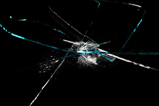 Broken glass texture and background, isolated on black, cracked window effect, clipping path   