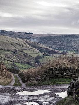 winter scene in the yorkshire dales at a crossroads with pennine moors and fields