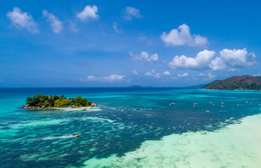 Fototapeta na wymiar Aerial view of beautiful island at Seychelles. Top view from drone