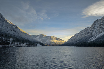 landscape of lake plansee in winter while sunrise with sunlight at mountain