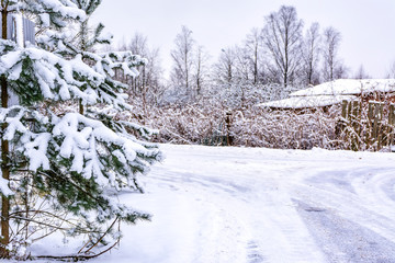 Winter sketches. Fluffy snow on houses, fences and other buildings.