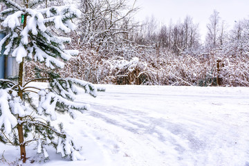 Winter sketches. Fluffy snow on houses, fences and other buildings.