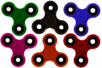 Collection of colorful fidget spinner, a stress relieving toy, isolated on white background. Directly above.