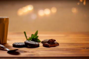 Chocolate cookies on a wooden rustic table.