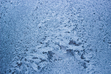 Winter patterns on the window. Frosty backgrounds