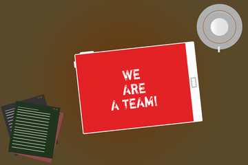 Handwriting text writing We Are A Team. Concept meaning Work together to accomplish a common vision or goals Tablet Empty Screen Cup Saucer and Filler Sheets on Blank Color Background