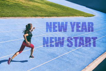 New Year resolution fitness concept. New Year New Start athlete runner sprinting on blue race tracks racing to the finish line in goal achievement challenge. Starting life change woman.