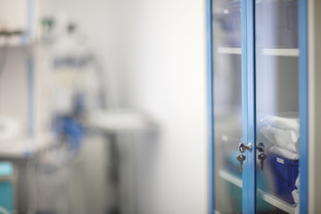 Lockable doors of the glass cabinet for medicines and accessories in the dental clinic