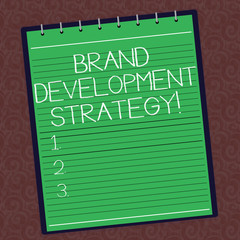 Text sign showing Brand Development Strategy. Conceptual photo analysis and planning of brand perceive in market Lined Spiral Top Color Notepad photo on Watermark Printed Background