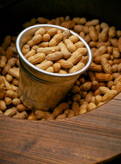 peanuts in shell in a metal buket