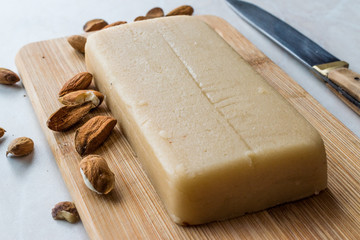 Homemade Almond Paste Whole Marzipan on Wooden Board.