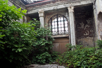 Fototapeta na wymiar Abandoned overgrown interior of railway station in Sukhum, Abkhazia