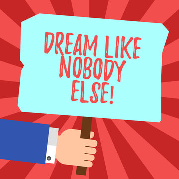 Handwriting text Dream Like Nobody Else. Concept meaning Have mote motivation inspiration than others Hu analysis Hand Holding Blank Colored Placard with Stick photo Text Space