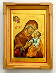 Old wooden icon on white background madonna and child