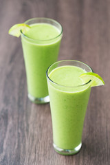 Green fresh smoothie with avocado and banana in glass, healthy lifestyle, vegan nutrition,