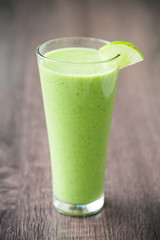 Green fresh smoothie with avocado and banana in glass, healthy lifestyle, vegan nutrition,