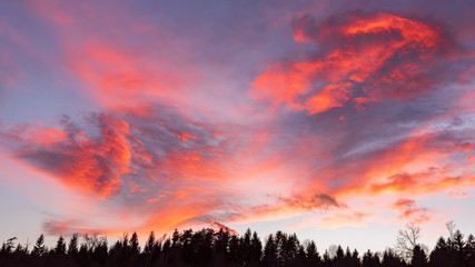Fototapeta premium Clouds red orange blue and violet color sunset dramatic sky background