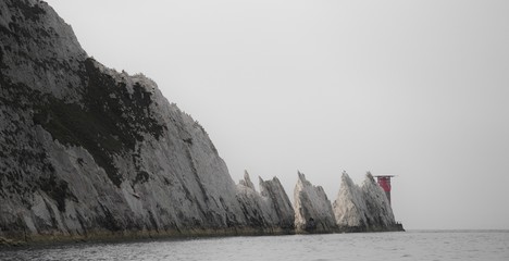 The Needles, Isle of Wight, England: chalk cliffs and lighthouse on a grey day