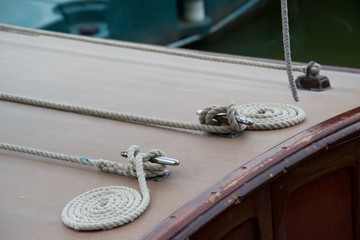 Neat coiled ropes on a wooden boat