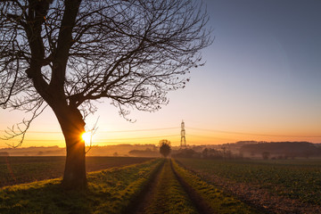 Sunset Over Countryside With Path