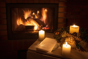 Christmas floral decoration with wafer in front of firepace.