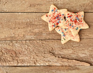 Star cookies on rough wood background