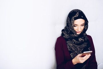 Middle eastern ethnicity woman using smartphone