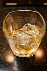 whiskey glass on a wooden table