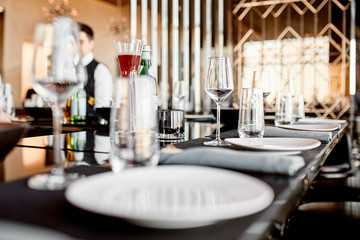 Photo of glass and plates with on the table