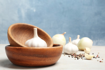 Composition with garlic bulb on table. Space for text