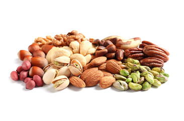 Pile of mixed organic nuts on white background