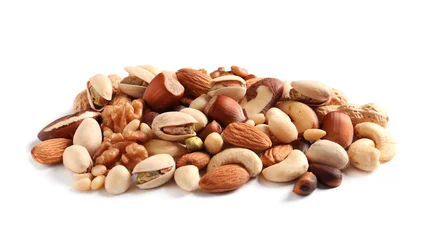 Fotobehang Pile of mixed organic nuts on white background © New Africa