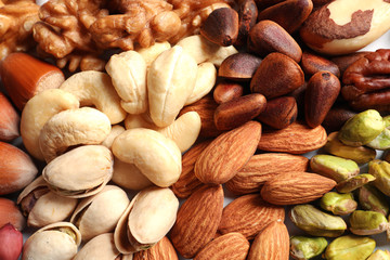 Mixed organic nuts as background, top view. Tasty snack