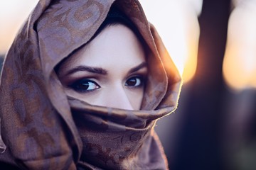 Young sad arabic woman in hijab