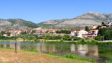 Fototapeta na wymiar View Over Trebisnjica River and Trebinje, Bosnia and Herzegovina with The Mountains Behind