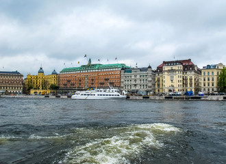Panoramic view from the tourist sightseeing boat to the beautiful buildings of Stromkajen in the center of Stockholm Sweden