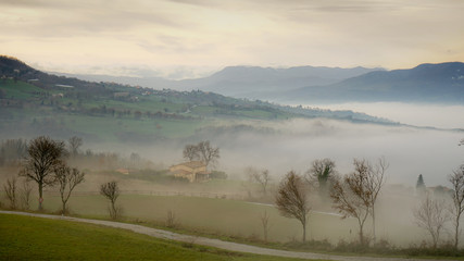 Obraz na płótnie Canvas low clouds on italian countryside