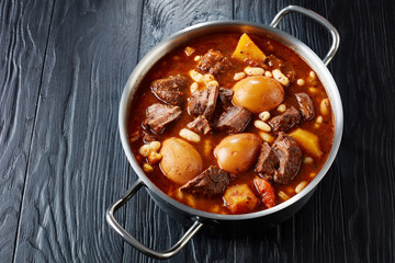 Jewish Cholent in a metal casserole, close-up