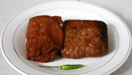 Tempe and tahu bacem. Traditional foods from Java, Indonesia. Made from soya bean. Bacem means sweet.