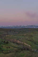 Pink lenticular clouds on sunset during spring season in Patagonia.
